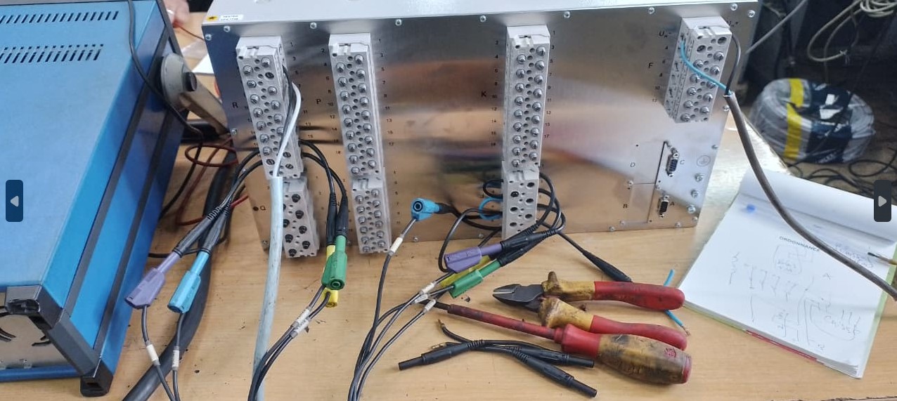 Setup of the OMICRON CMC kit for electrical protection testing.